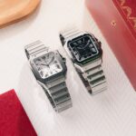 hands on two sporty new variants of the cartier santos one in titanium the other in steel with a black dial and lume 68e49f35392a1